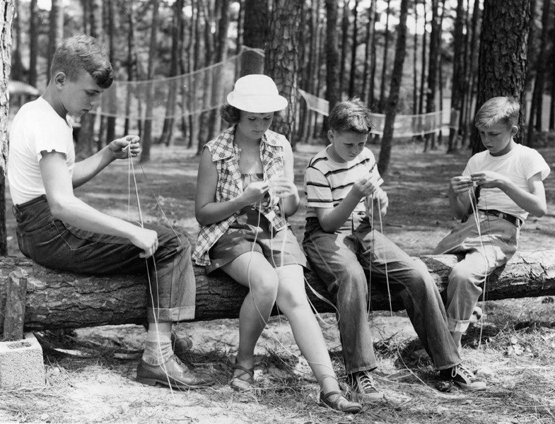 Children work on a project at summer camp in the 1950s.